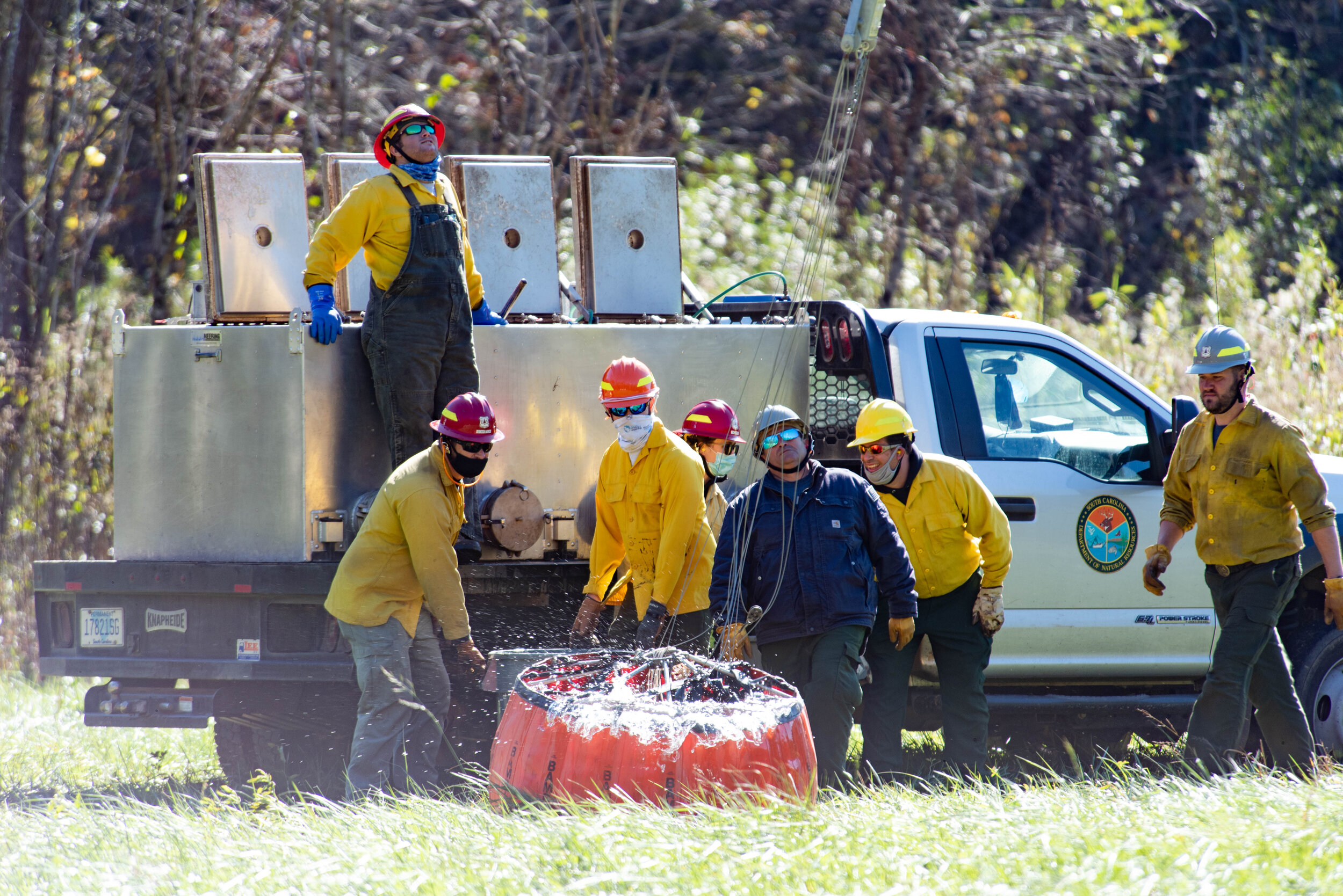 Watching an experienced team of fisheries biologists and volunteers work with a helicopter pilot to fill and drop brailer bags of trout in a remote river is a little bit like experiencing a ballet — lots of moving parts have to come together with j…