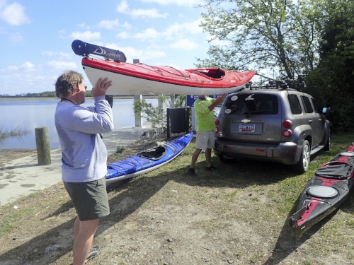 Helping load the boats (note unflattering waistline - aka the editorial bulge).photo by Nancy Stills, Sun City Hilton Head Kayak Club