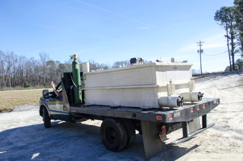 Boykin Gaskins waves goodbye as he leaves CCFC with a full load of redbreast frythat will be released at several points on the Little Pee Dee River.