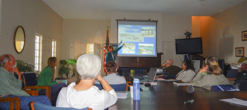 Seminar participants listen intently as t Felicia Sanders walks them through some of the cutting-edge research into migratory shorebirds that she and other SCDNR biologists are involved with.