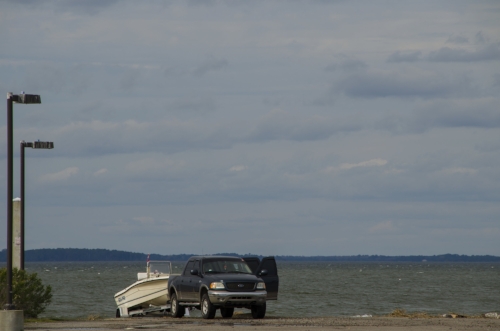 Getting on the water is a high priority for lots of Lowcountry visitors and locals. Above: Launching a boat at Beaufort's Broad River Landing. Below: tourists on a guided paddling trip explore a shell rake near Fripp Inlet.