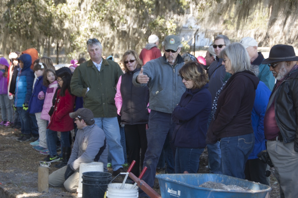 Taylor points out some of the the &nbsp;"features" located by the USC Institutute for Archaeology and Anthropology crew excavating the trench inside the fort's walls.