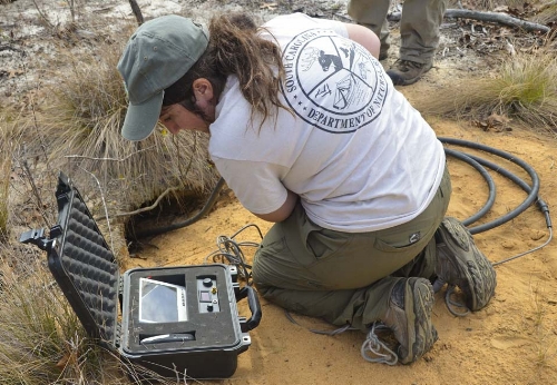 (Above) Jonathan Cooley &amp; Joel Mota &nbsp;use a VHF receiver to get a fix on a transmitter-tagged tortoise in its burrow. (Below) Olivia Thomas uses a "scope" -- a tiny camera attached to a flexible fiber-optic cable -- to get a visual a a torto…
