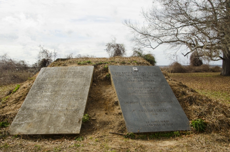 These monuments at the base of the mound provide detail about its role as the location for a Revolutionary War fort.