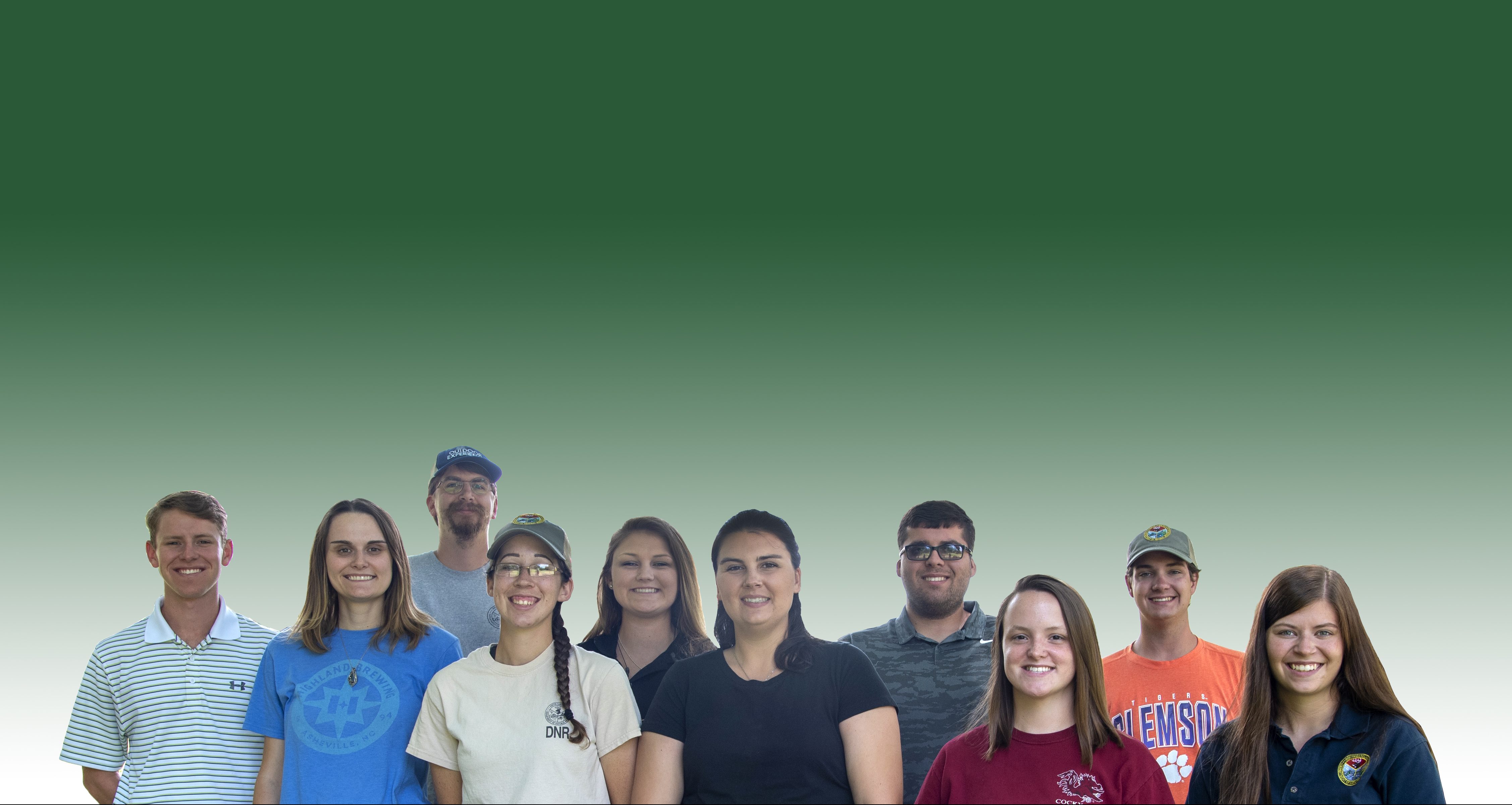 Fisheries interns facing reader smiling