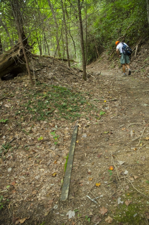 "Cousin" Greg heads on up the trail while I pause for a few minutes to take a picture of this piece of railroad steel (because it's really interesting, most definitely NOT because I am doubled over huffing and puffing and about to blow my bonus lunc…